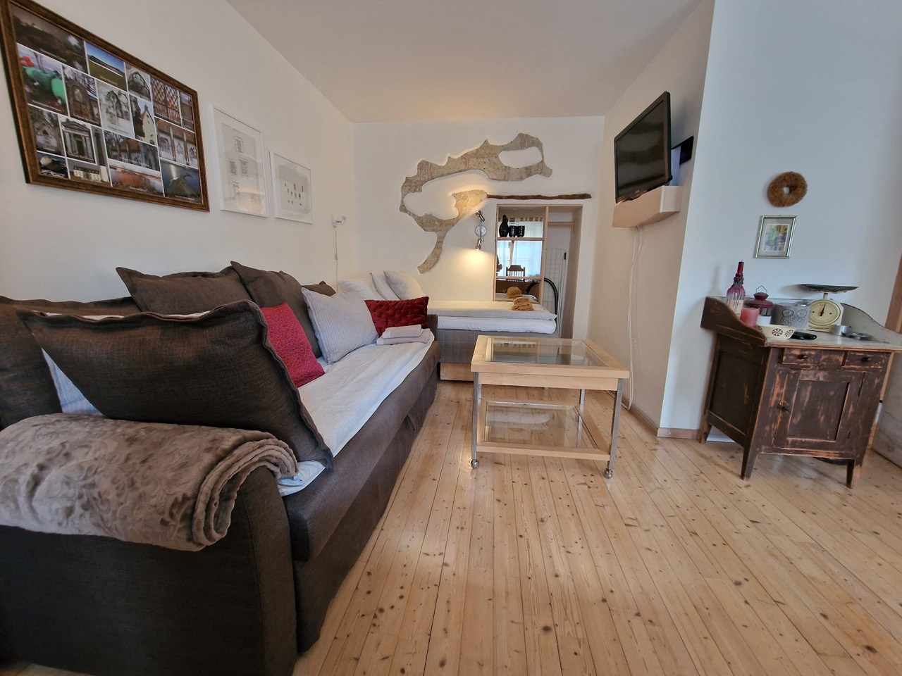 lounge with large sofa-bed and bed